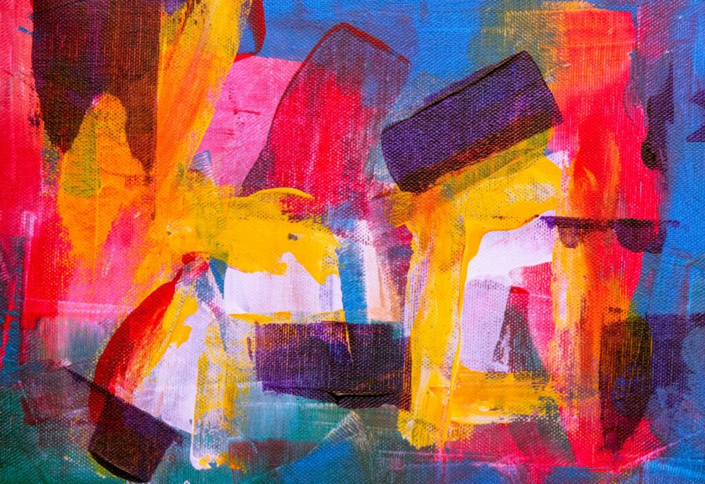 Colorful abstract painting with vivid brush strokes and vibrant colors on canvas.